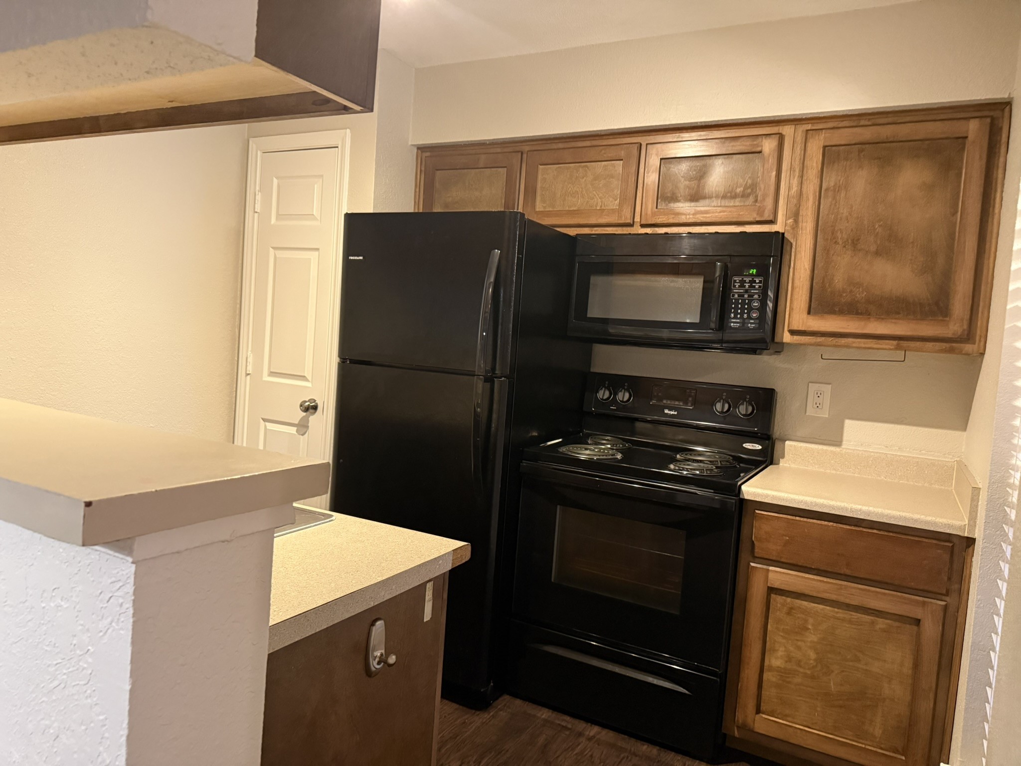 16303 Lyons School Road, Unit 304 Spring, TX 77379 - Photo 2 of 17 a kitchen with a refrigerator stove and microwave