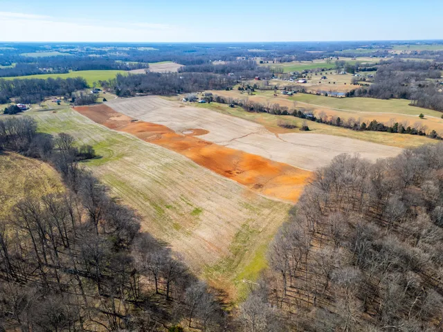 a view of a lake with beach and mountain view