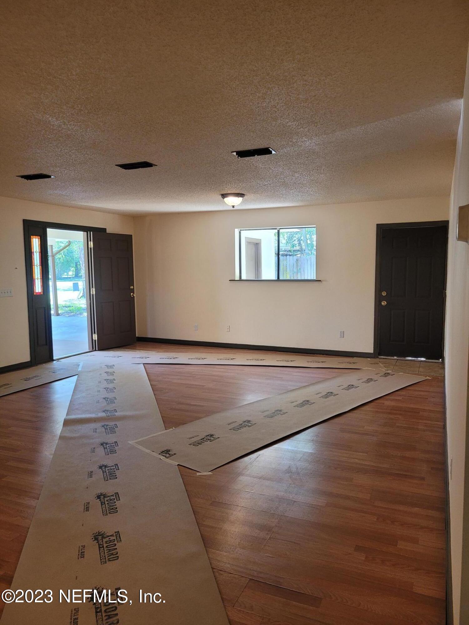 7925 Chateau Drive Jacksonville, FL 32221 - Photo 14 of 24 a view of a hallway with wooden floor