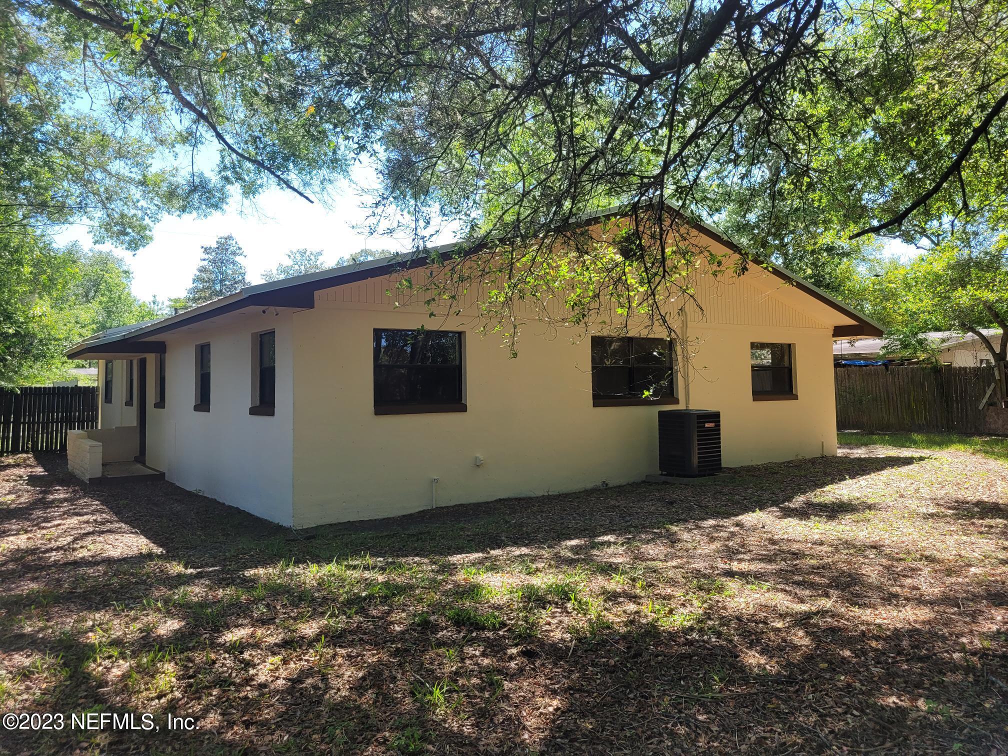 7925 Chateau Drive Jacksonville, FL 32221 - Photo 21 of 24 a view of a house with a yard