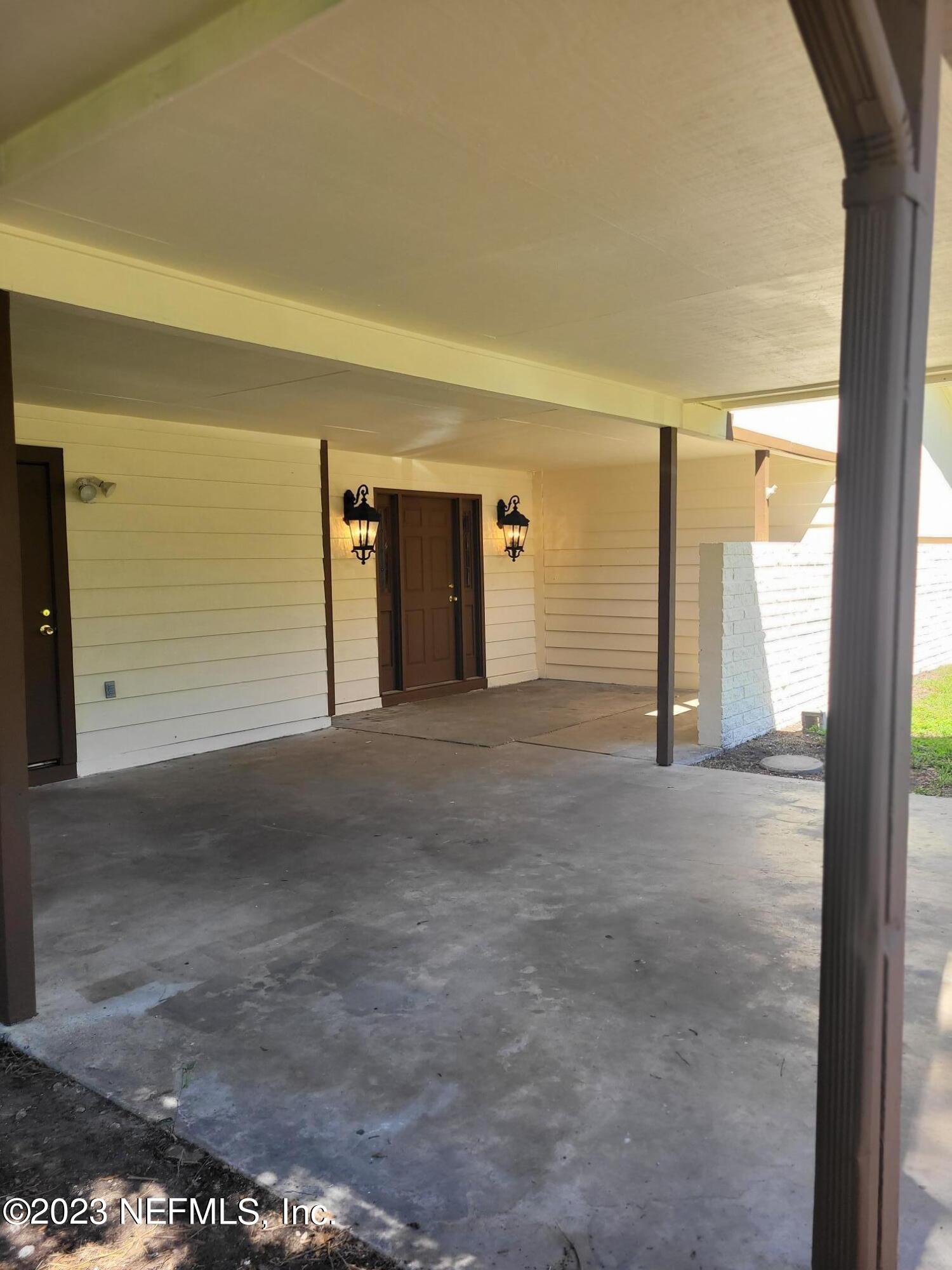 7925 Chateau Drive Jacksonville, FL 32221 - Photo 4 of 24 a view of a big room with closet and chandelier fan