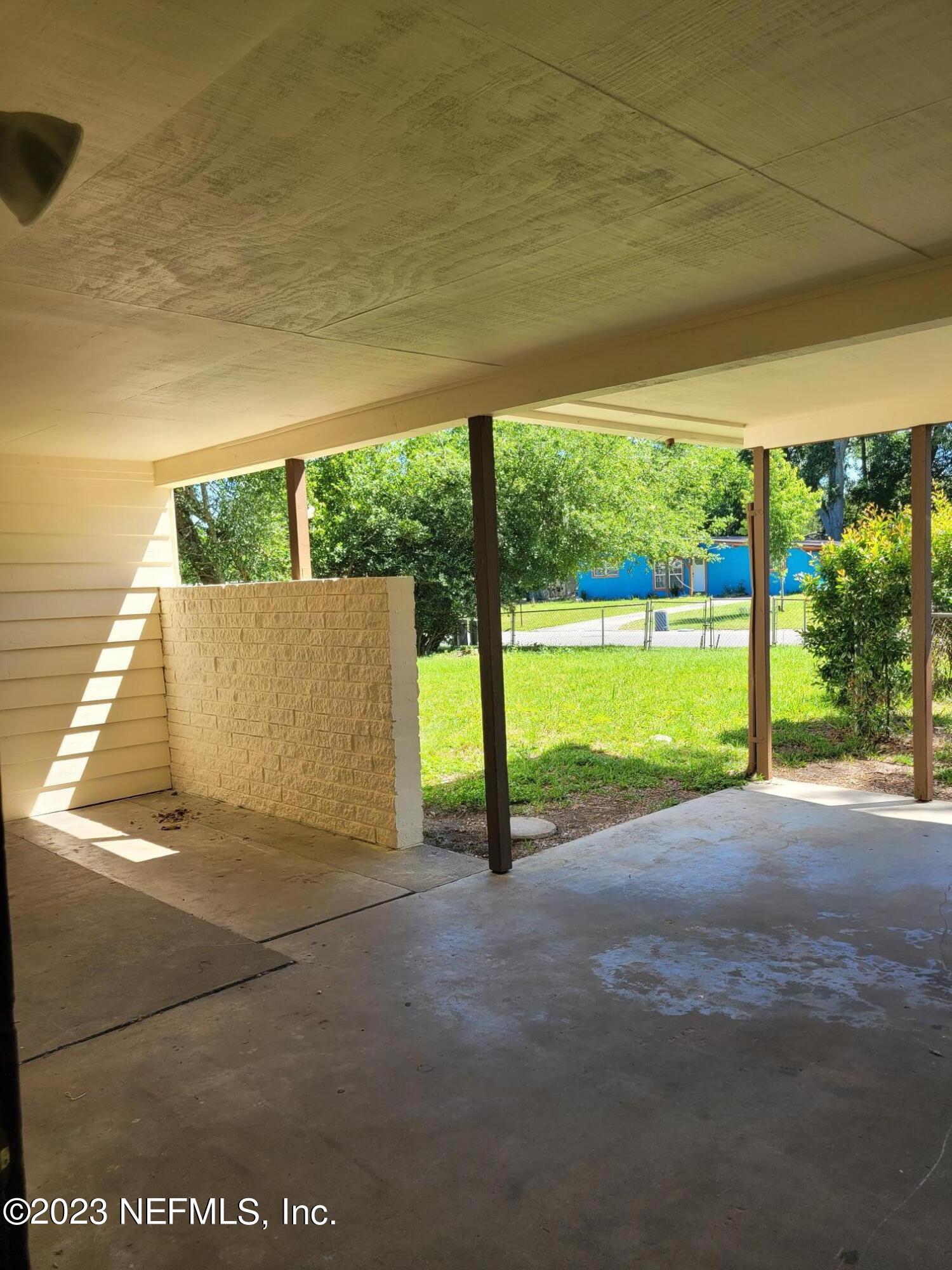 7925 Chateau Drive Jacksonville, FL 32221 - Photo 6 of 24 a view of a yard with an outdoor seating