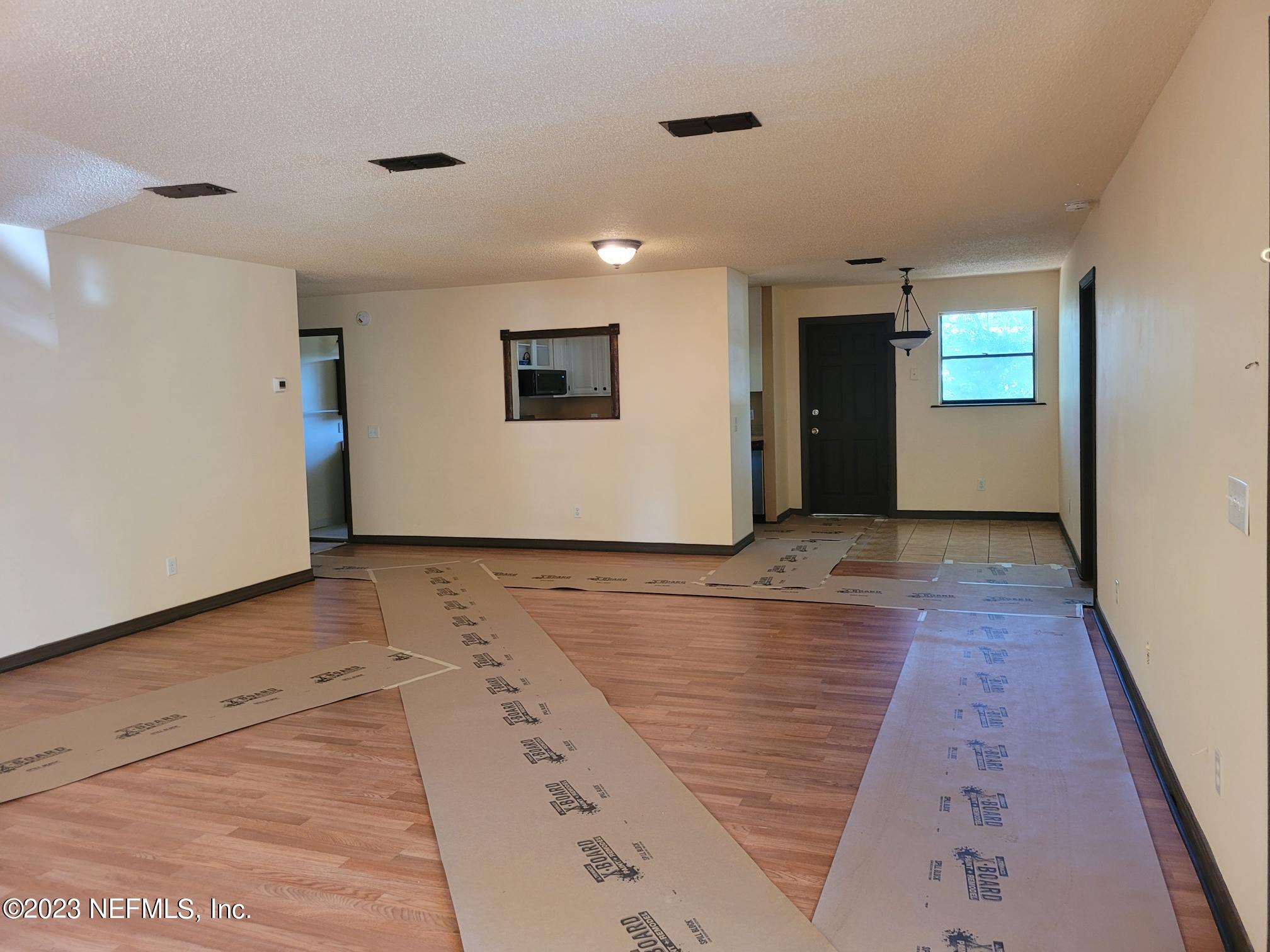 7925 Chateau Drive Jacksonville, FL 32221 - Photo 7 of 24 a view of a livingroom with wooden floor