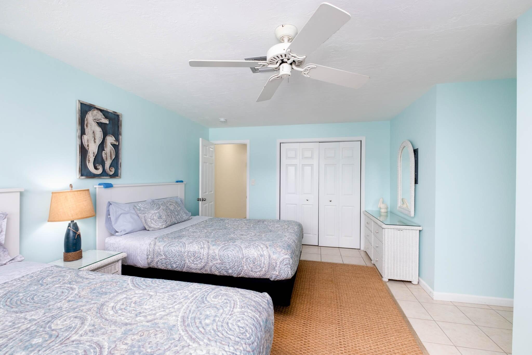 261-271 9th Street Key Colony Beach, FL 33051 - Photo 42 of 68 a bedroom with a bed and a chandelier