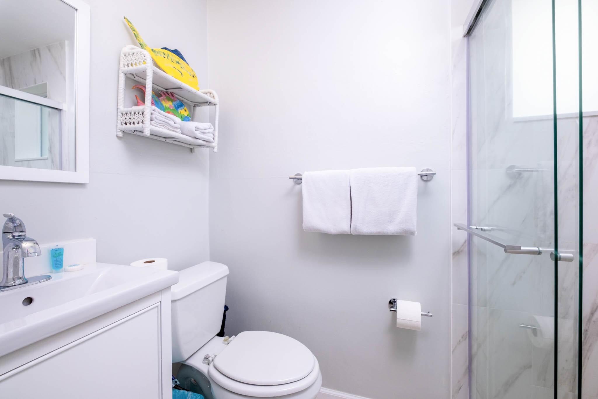 261-271 9th Street Key Colony Beach, FL 33051 - Photo 44 of 68 a white toilet sitting next to a bathroom sink