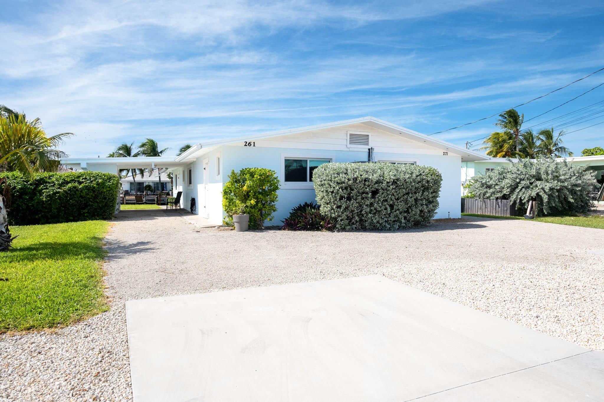 261-271 9th Street Key Colony Beach, FL 33051 - Photo 10 of 68 a front view of a house with garden