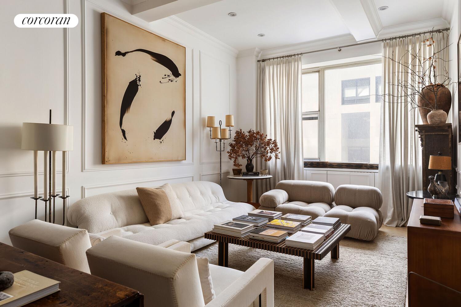 315 7th Avenue, Unit 4D Manhattan, NY 10001 - Photo 2 of 19 a living room with furniture and a large window