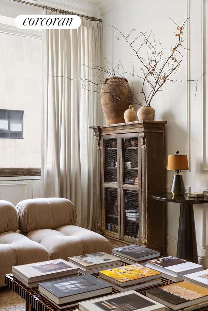 315 7th Avenue, Unit 4D Manhattan, NY 10001 - Photo 6 of 19 a bedroom with a bed and a chandelier