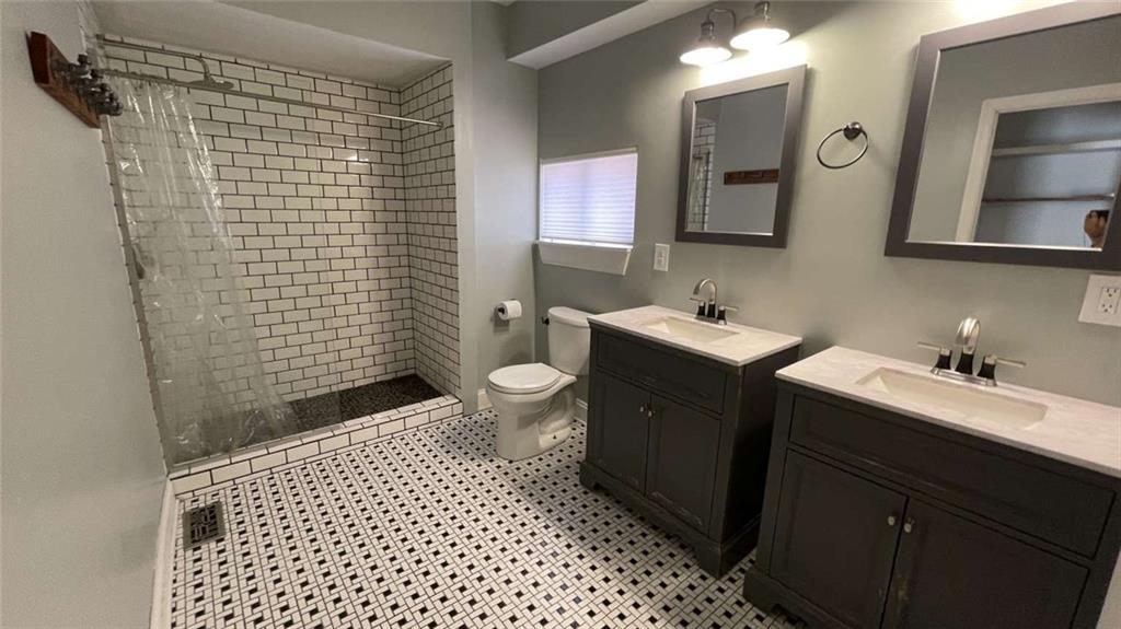 615 Tripoli Street Pittsburgh, PA 15212 - Photo 12 of 25 a bathroom with a sink toilet and shower