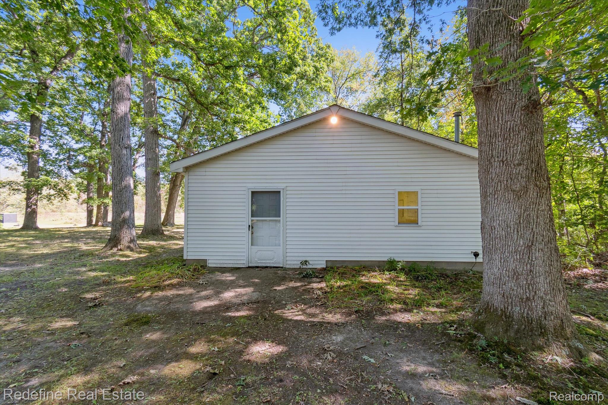 3777 Dorr Road Brighton, MI 48116 - Photo 56 of 77 Rear view of house