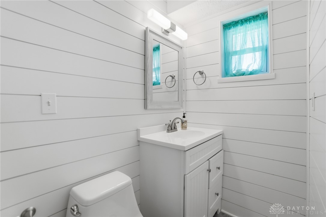 629 Storms Road Dayton, OH 45429 - Photo 42 of 51 This clean and bright bathroom features a modern vanity and a refreshing window, creating a serene space.