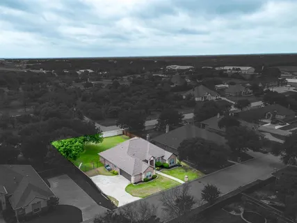 an aerial view of a house with a garden
