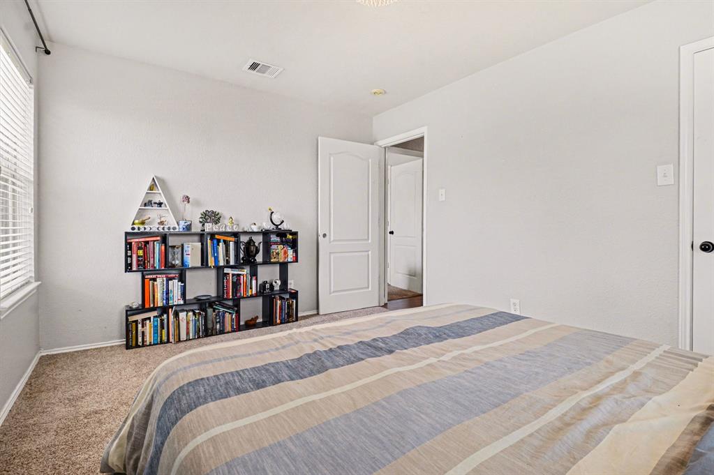 10005 Turrey Rowlett, TX 75089 - Photo 22 of 32 Bedroom with carpet floors and multiple windows