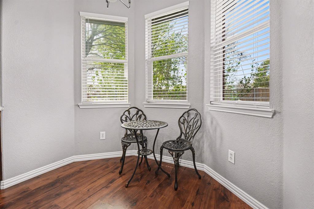10005 Turrey Rowlett, TX 75089 - Photo 10 of 32 Sitting room with a textured wall, dark wood finished floors, and plenty of natural light