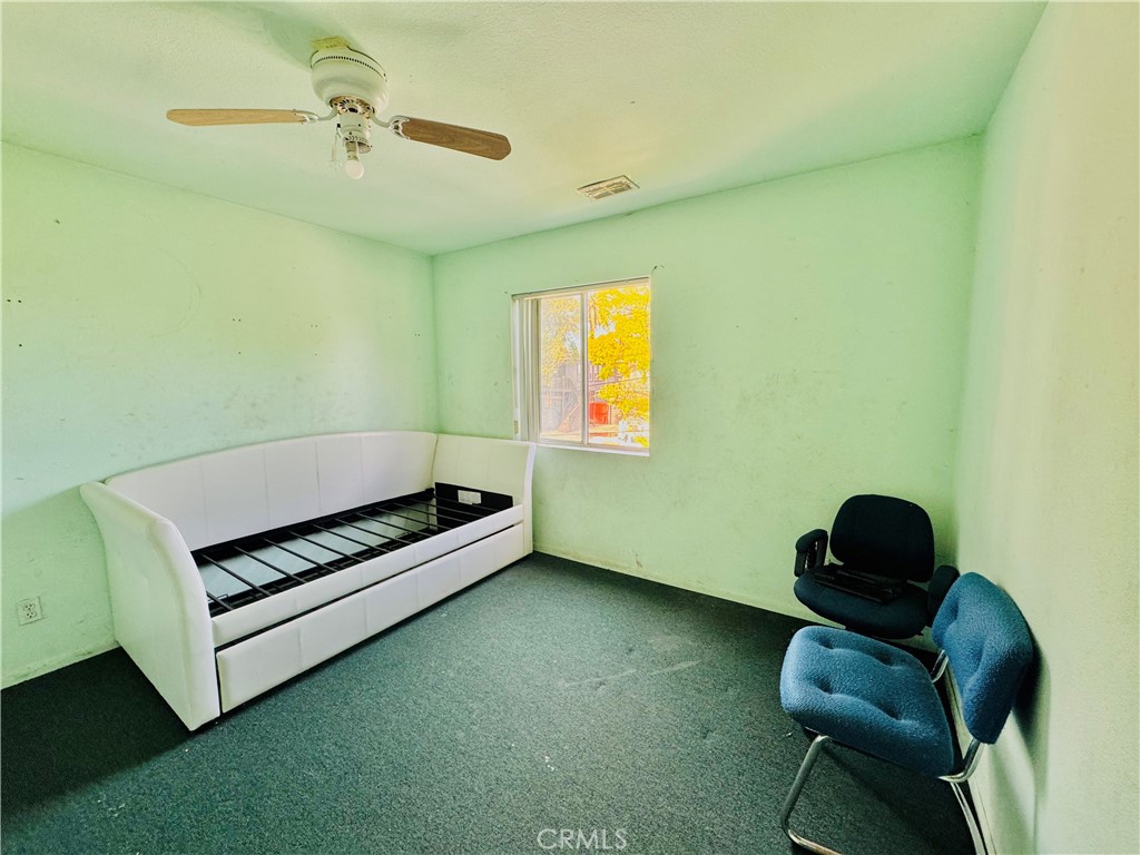 812 East 8th Street Long Beach, CA 90813 - Photo 35 of 40 a bedroom with a bed and a chair