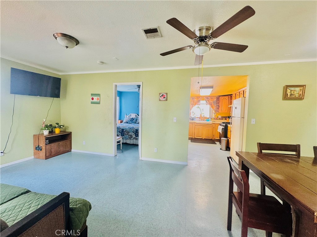 812 East 8th Street Long Beach, CA 90813 - Photo 9 of 40 a workspace with furniture and ceiling fan