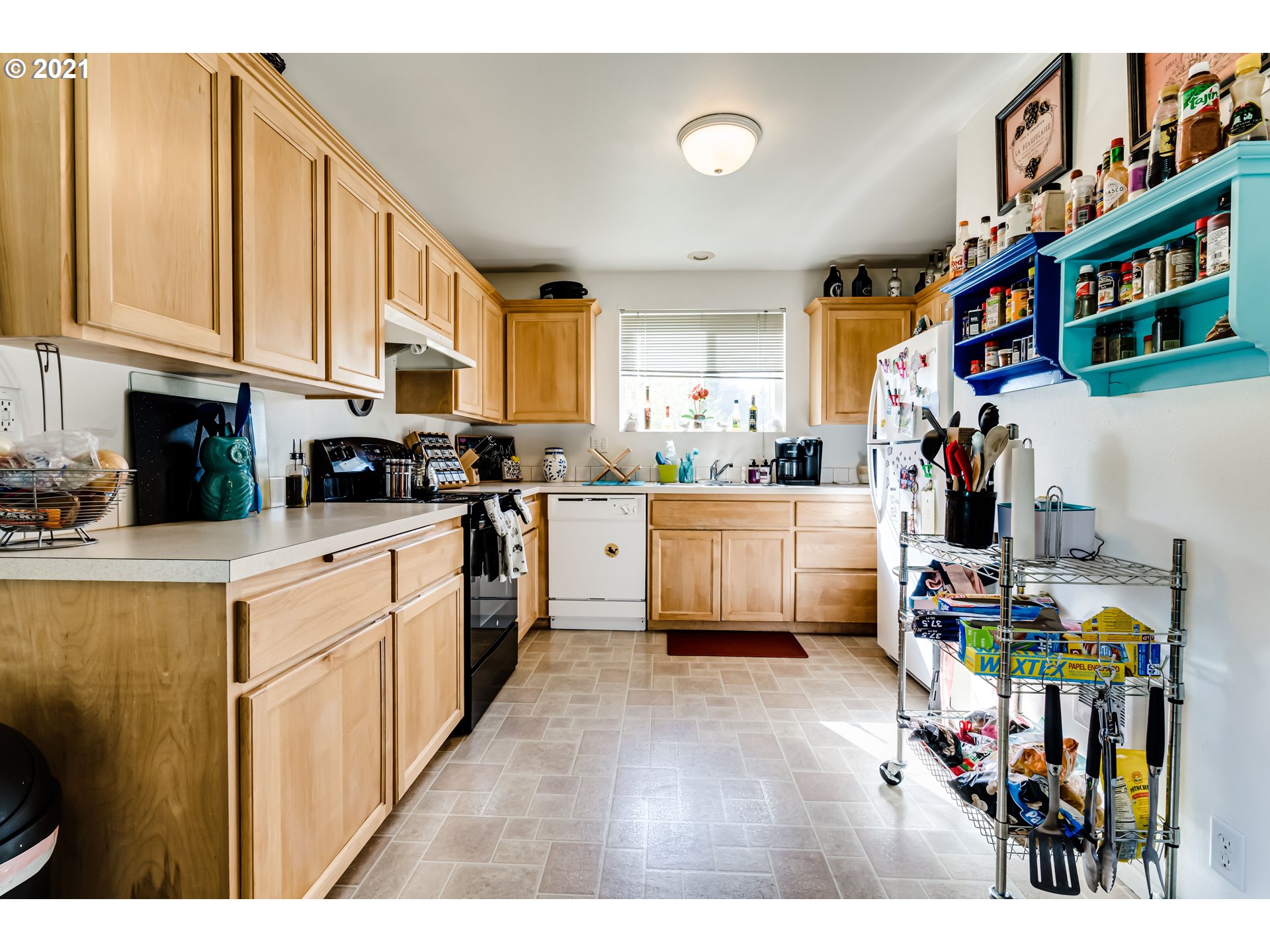 814 L Street Springfield, OR 97477 - Photo 12 of 23 a kitchen with stainless steel appliances a sink and a refrigerator