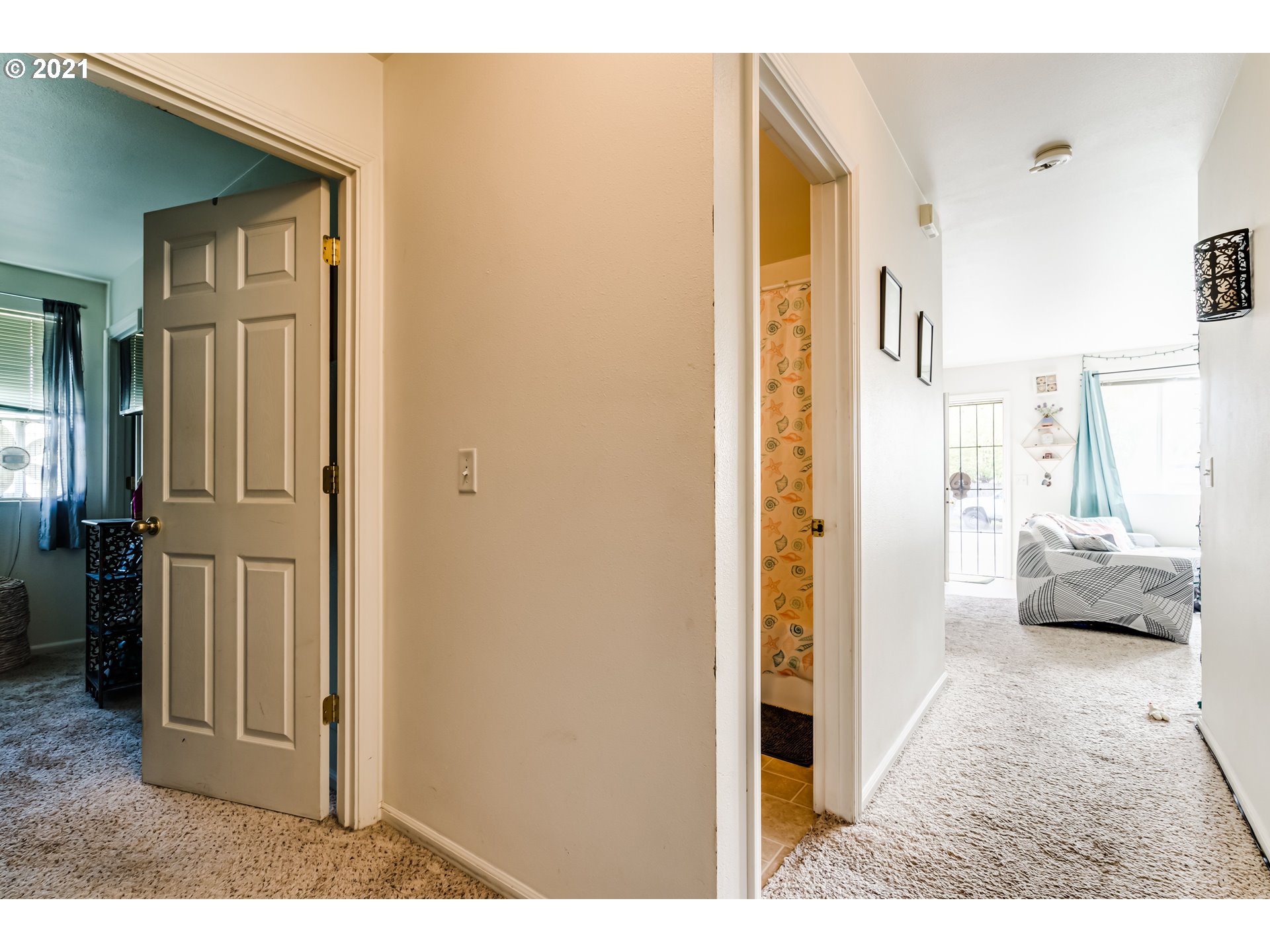 814 L Street Springfield, OR 97477 - Photo 14 of 23 a view of a bedroom from a hallway