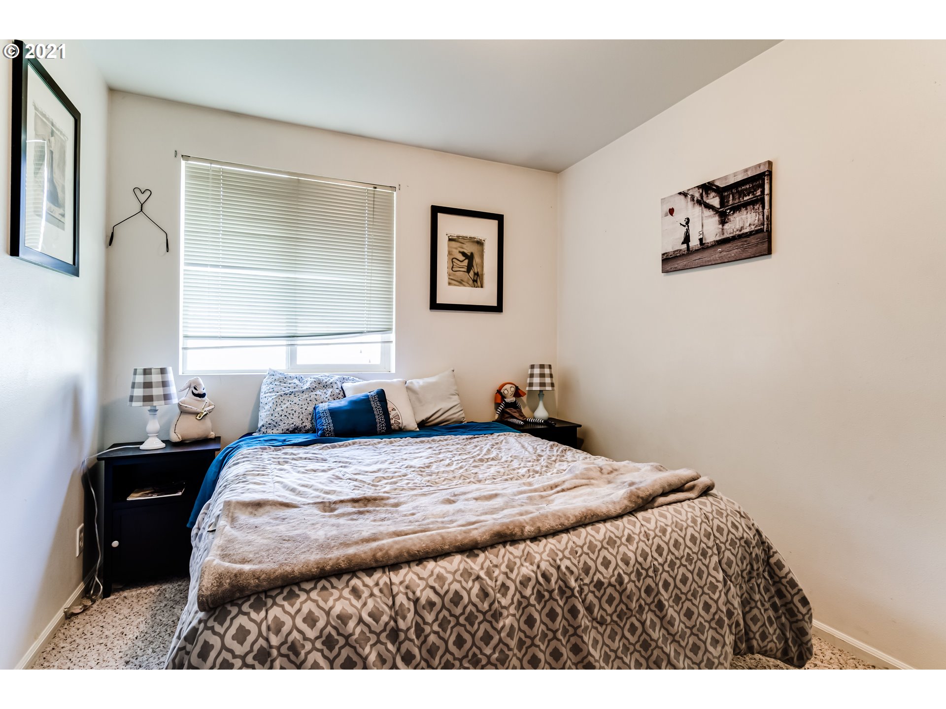 814 L Street Springfield, OR 97477 - Photo 18 of 23 a bedroom with a bed and a painting on the wall