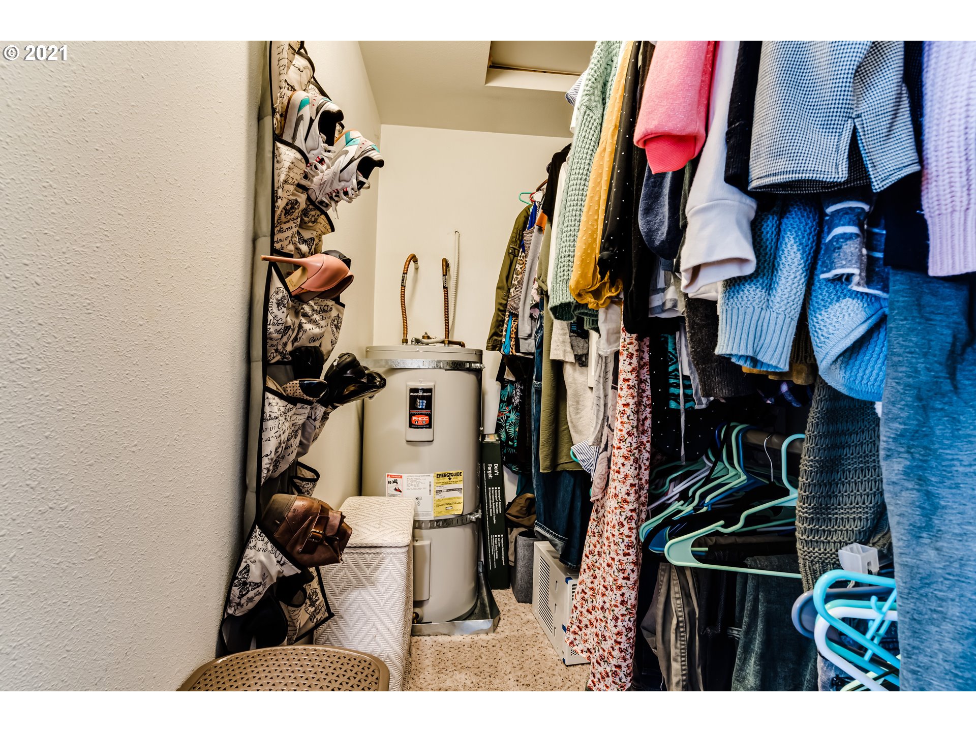 814 L Street Springfield, OR 97477 - Photo 22 of 23 a view of walk in closet with clothes and shoes