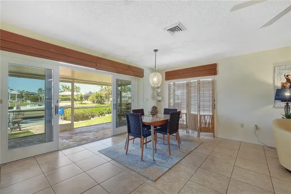 a dining room with furniture and window