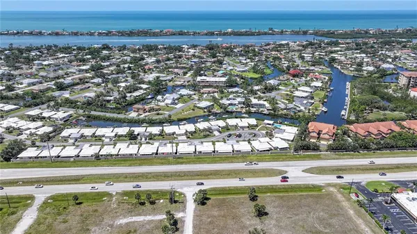 an aerial view of a houses with a lake view