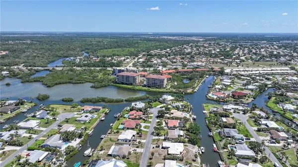 a view of a chairs and table in the balcony