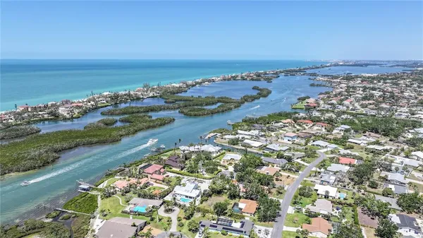 a view of a patio with a table chairs and a backyard