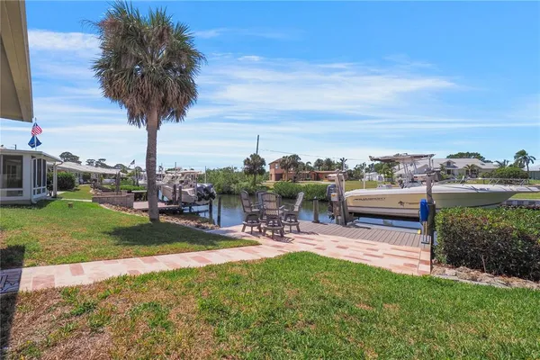 a view of a lake with a yard