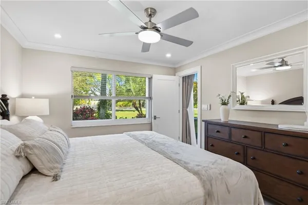 a bedroom with a large bed and a large dresser