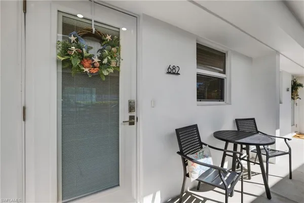 a view of a livingroom with furniture and a window