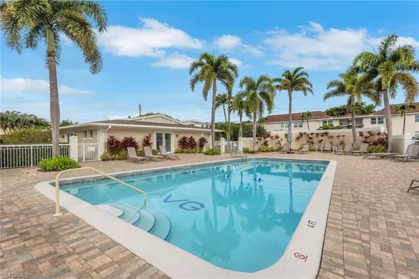 a view of a swimming pool with a patio