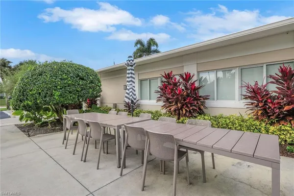 a view of an chairs and table in the patio