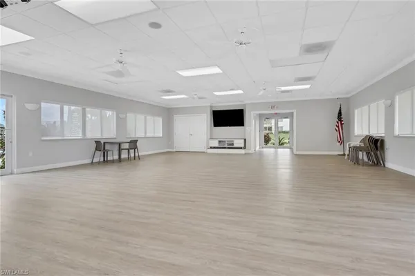 a view of kitchen with furniture and wooden floor