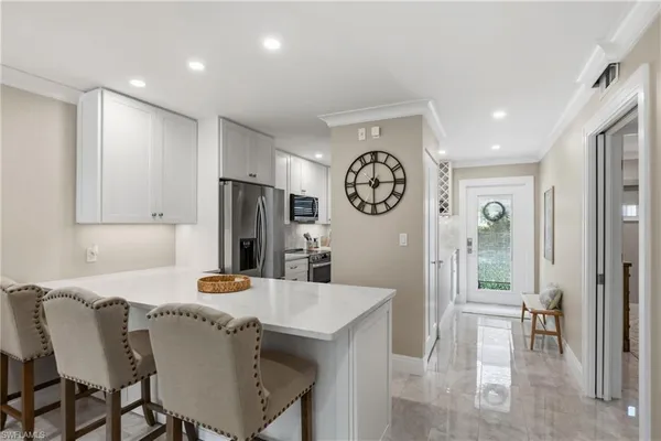 a kitchen with a table and chairs
