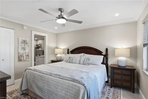 a bedroom with a bed and lamp