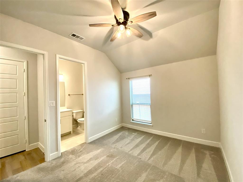 1937 Halkin Road Celina, TX 75009 - Photo 6 of 20 Bedroom featuring vaulted ceiling, ceiling fan, carpeting, window with blinds, and an attached bathroom with a single vanity