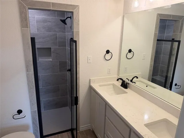 a bathroom with a sink and mirror