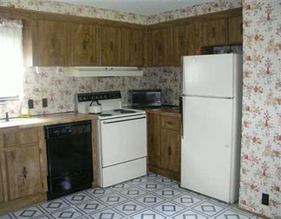 32700 Highway 6 Edwards, CO 81632 - Photo 3 of 5 a kitchen with a refrigerator sink stove and cabinets