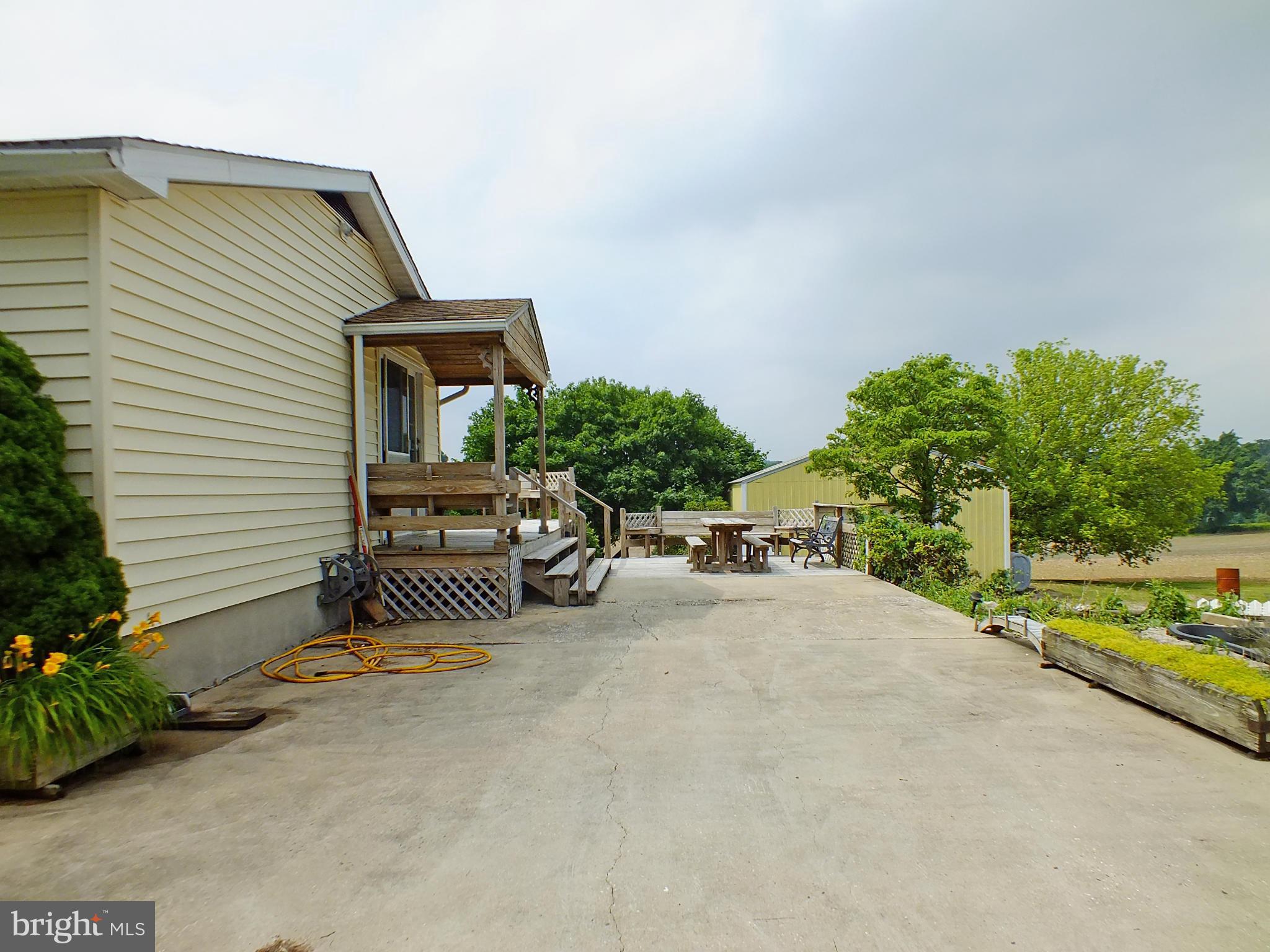 4124 Utz Road Hampstead, MD 21074 - Photo 23 of 30 Concrete Parking Pad, Kitchen Porch, 2nd Deck