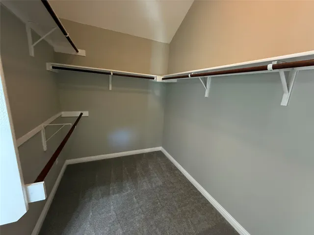 a spacious bathroom with a double vanity sink double vanity and a mirror