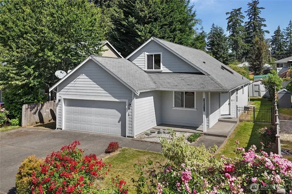 a view of front of house with a yard