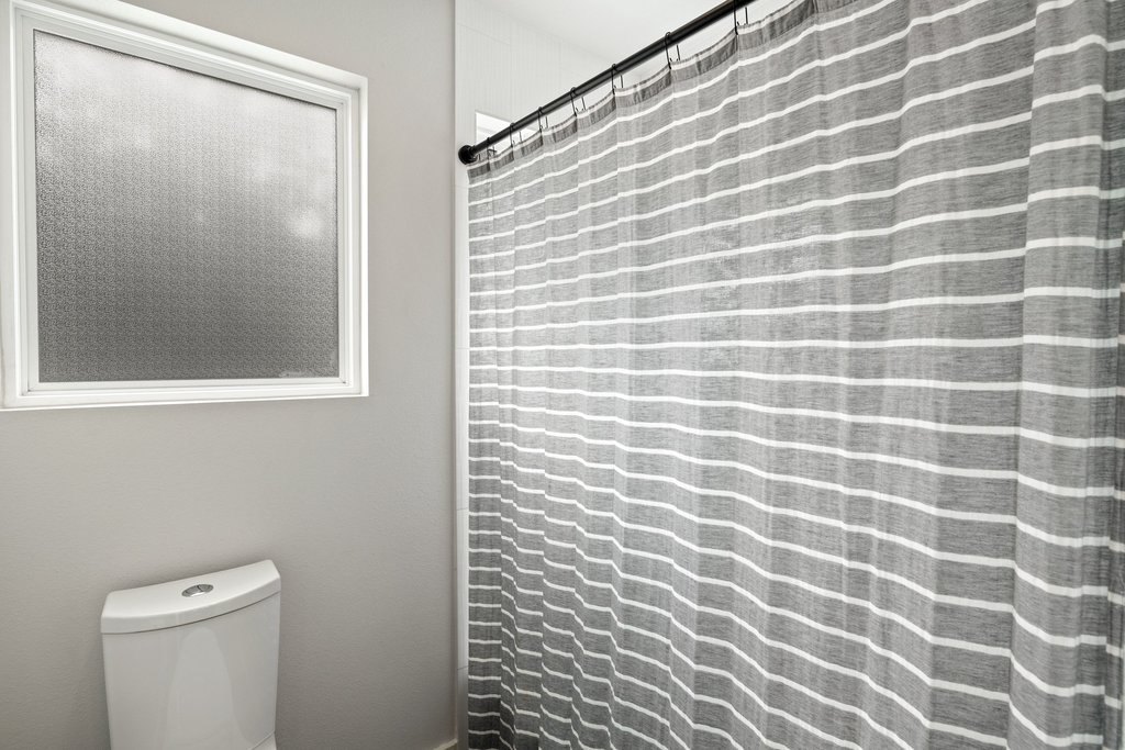 1182 Ridgeway Drive, Unit A Austin, TX 78702 - Photo 23 of 35 a bathroom with a shower