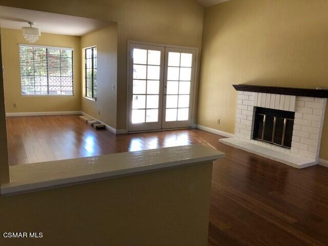890 Congressional Road Simi Valley, CA 93065 - Photo 4 of 10 a view of an empty room with wooden floor and a window