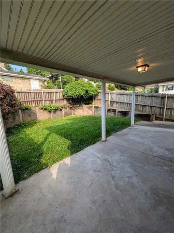 a view of a backyard of the house