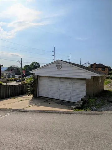 a front view of a house with a garage