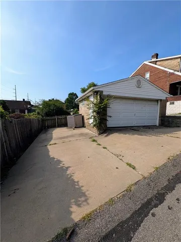 a view of a house with a snow in the yard