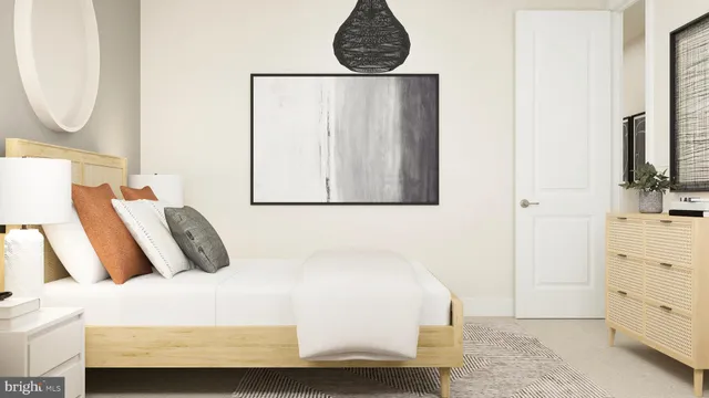 a bedroom with a bed and a mirror