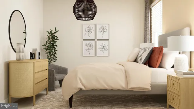 a bedroom with a bed and a painting on the wall