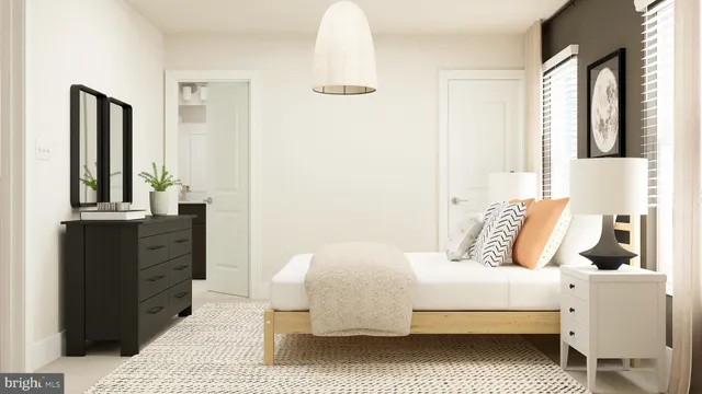 a bedroom with a bed and a dresser